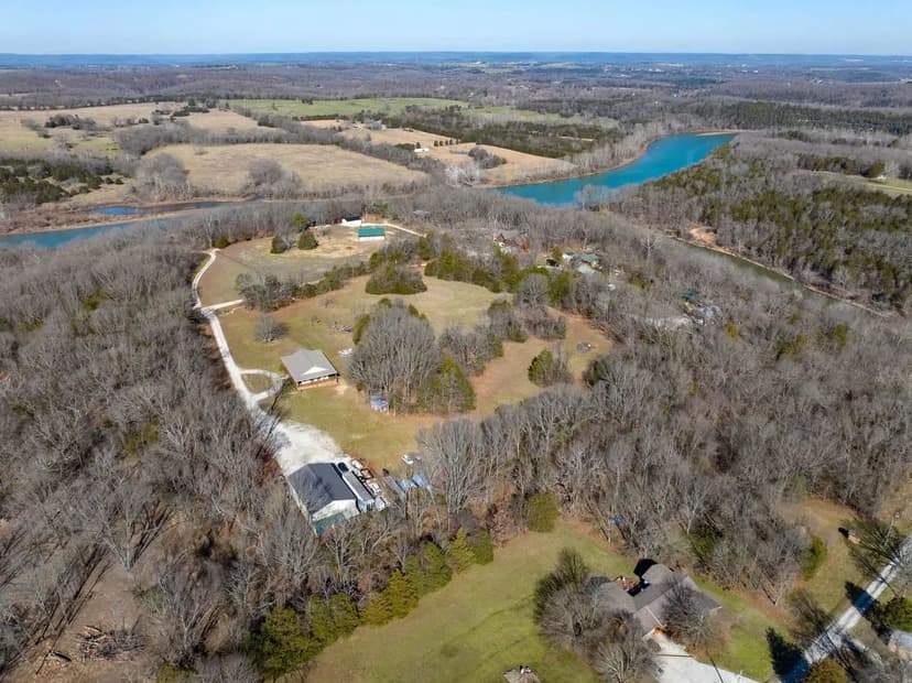 Amazing custom Table Rock Lake lakeside home at Kings River with an additional one bed one bath in the shop and 10 +/- acres