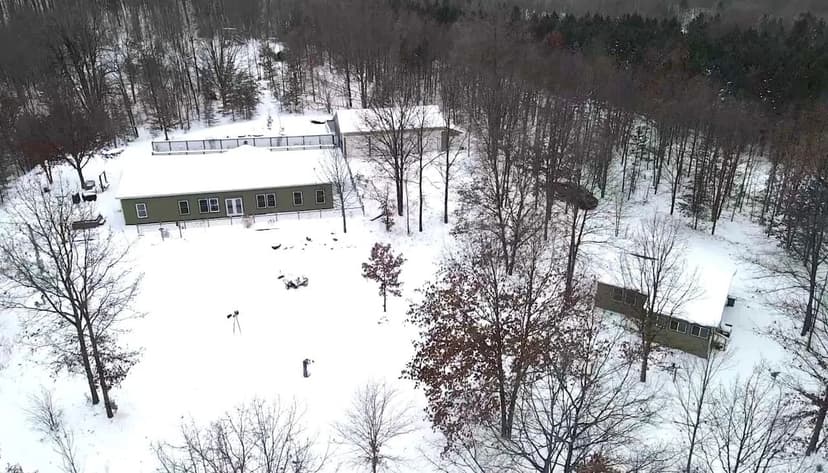 18 +/- Acre Missaukee County Estate w/ Home, Guest House & 4-Bay Garage